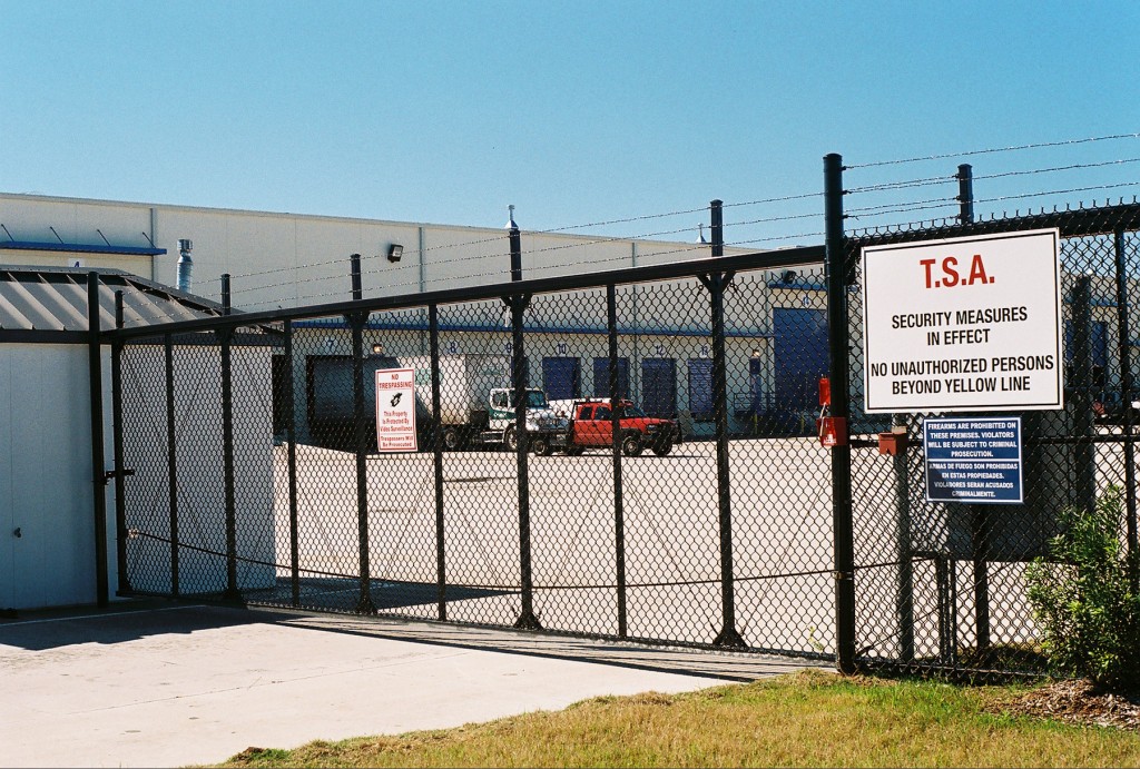 an industrial metal security gate protecting a TSA check point
