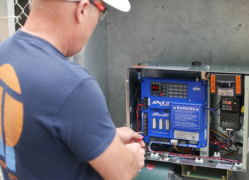 TYMETAL employee working on panel