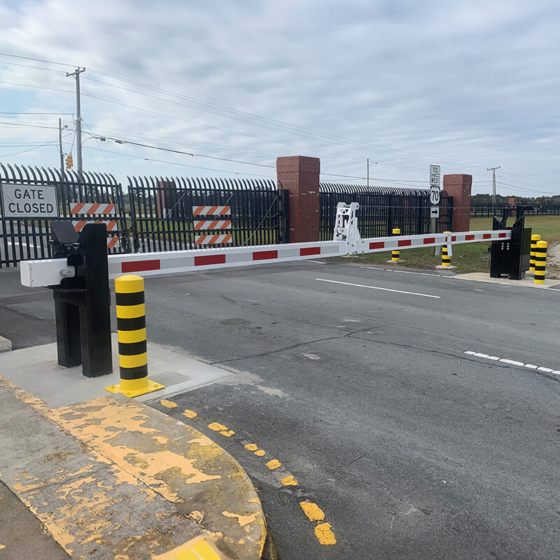 Crash beam on road in front of crash fence
