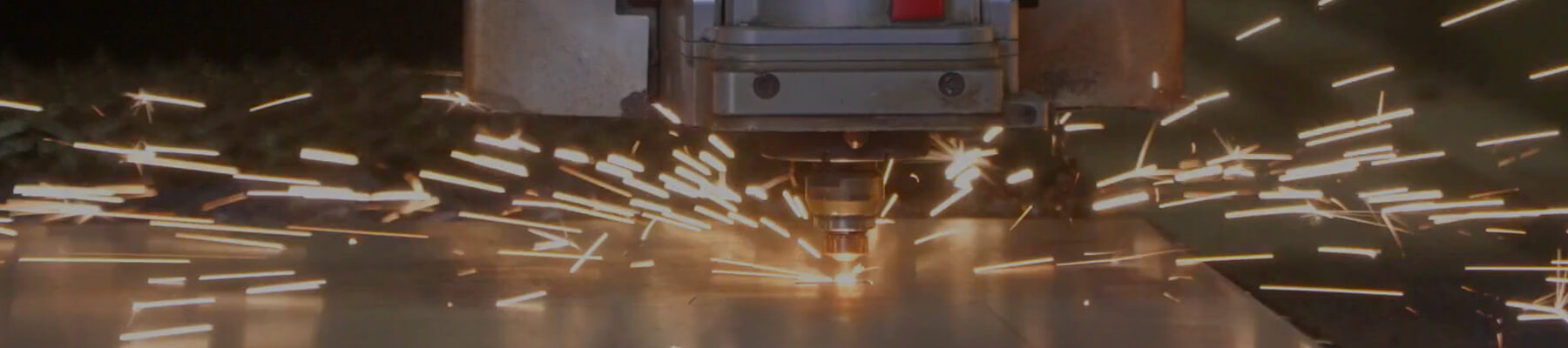 Sparks dispersing off laser cutter