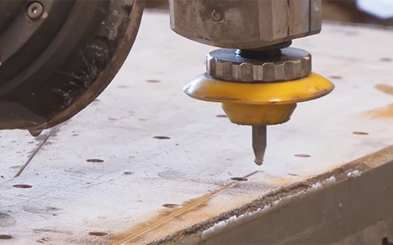 Closeup of waterjet cutting metal process
