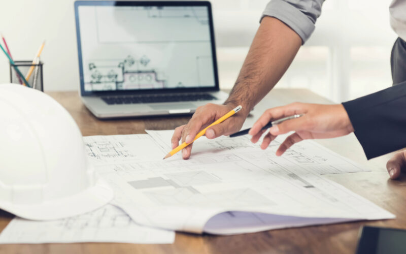 A team of executives discuss risk mitigation and commercial security measures