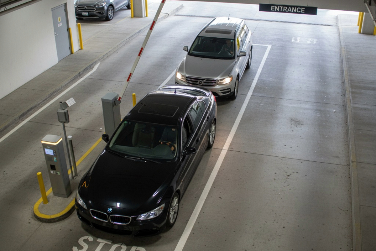 Two cars pull into a secure and private property, while the gate enforces anti-tailgating efforts.
