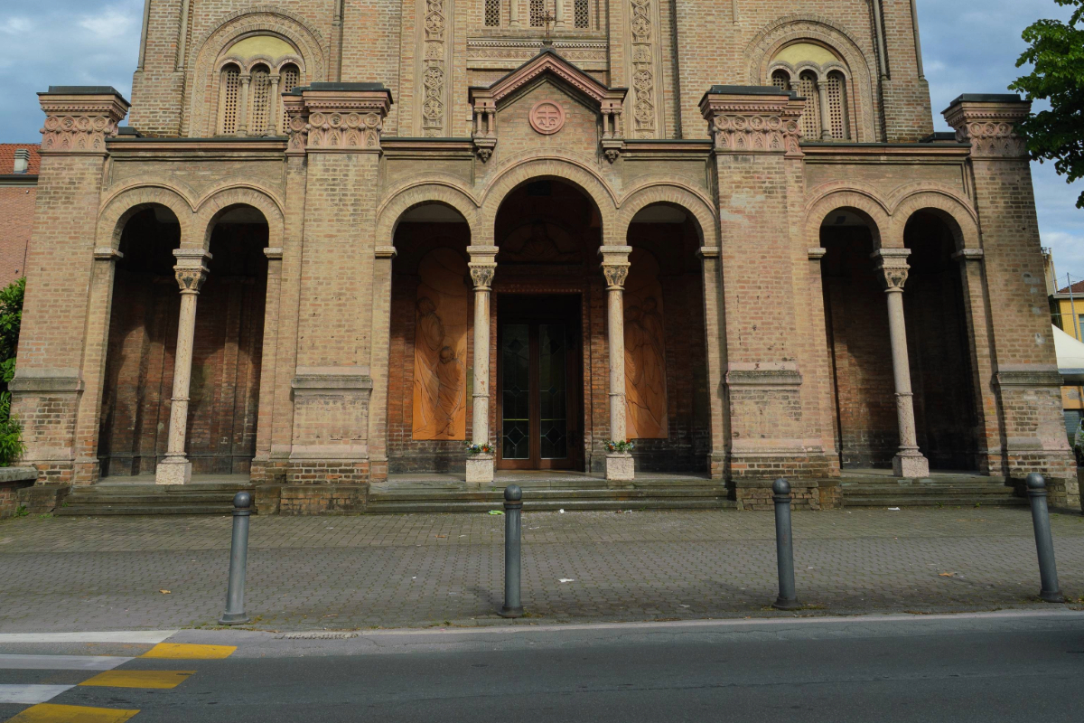 Crash-rated bollards stand outside a house of worship as a security measure.